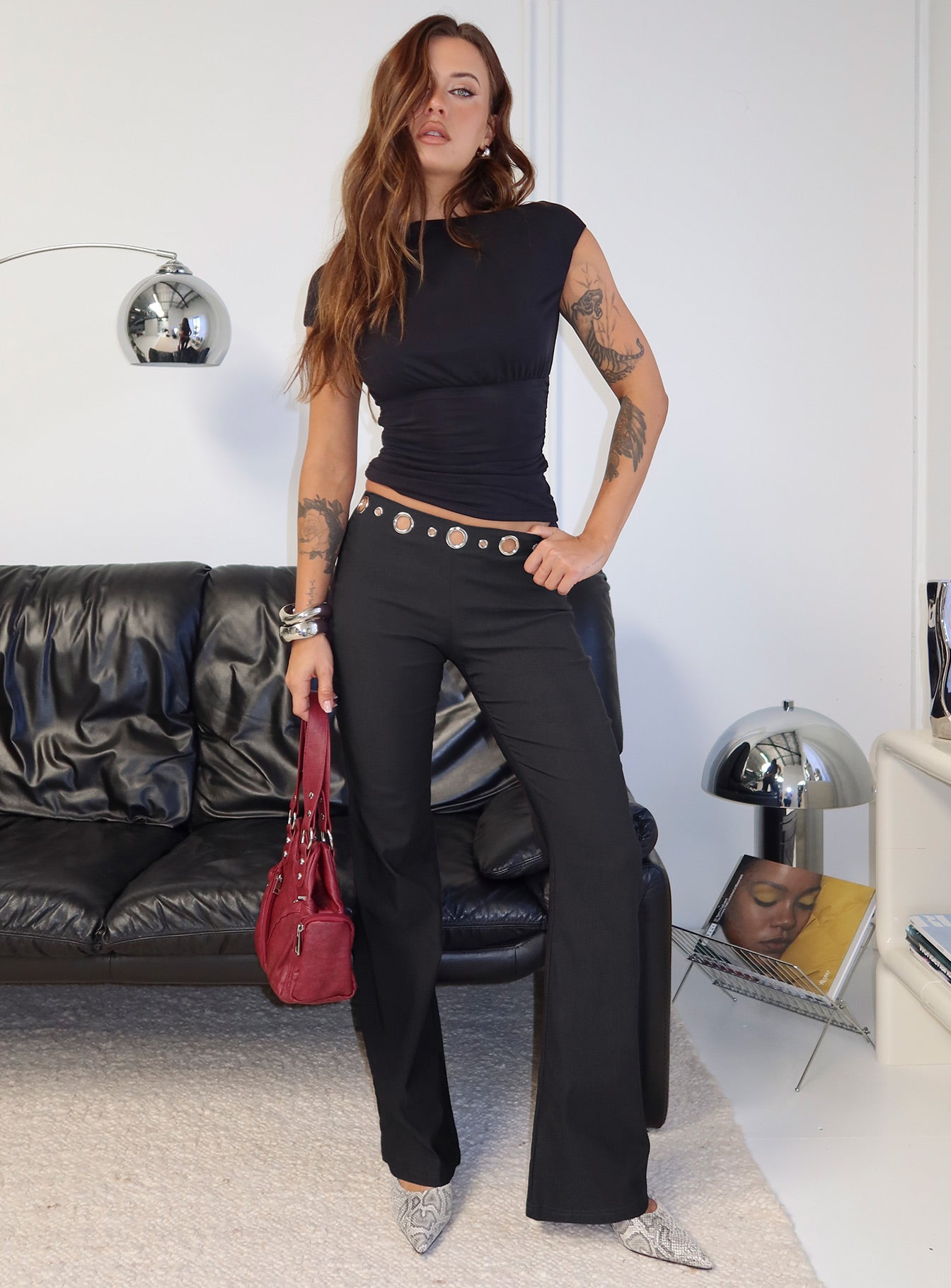 side view of model wearing Princess Polly True Grit Eyelet Flare Pants Grey Mid Rise Pants 