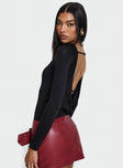 side view of model wearing Princess Polly Quinby Backless Long Sleeve Bodysuit Full Sleeves 