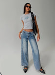 side view of model wearing Princess Polly Skipper Low Rise Baggy Jeans Vintage Blue Low Rise Jeans 