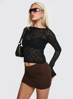   side view of model wearing Princess Polly Karley Low Waist Mini Skirt Chocolate Tall Mini Skirts 