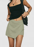 front view of model wearing Princess Polly Maceline Wrap Front Skort Green 