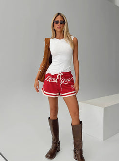 front view of model wearing Princess Polly Ny Trackstar Shorts Red Low Rise Shorts 