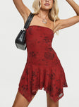 Red <ul> <li>Strapless mini dress</li> <li>Floral print, inner silicone strip at bust, asymmetric frill hem</li> </ul>