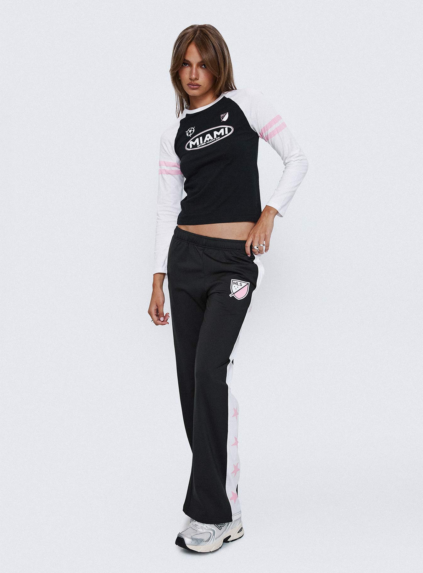 front view of model wearing Princess Polly Track Star Pants Black Low Rise Pants 