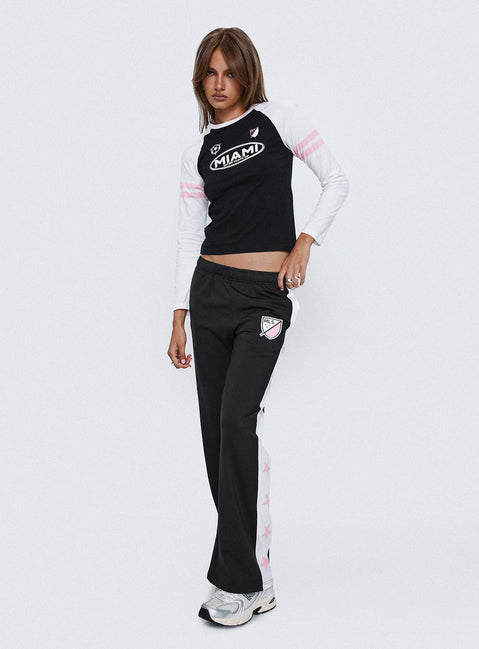 front view of model wearing Princess Polly Track Star Pants Black Low Rise Pants 