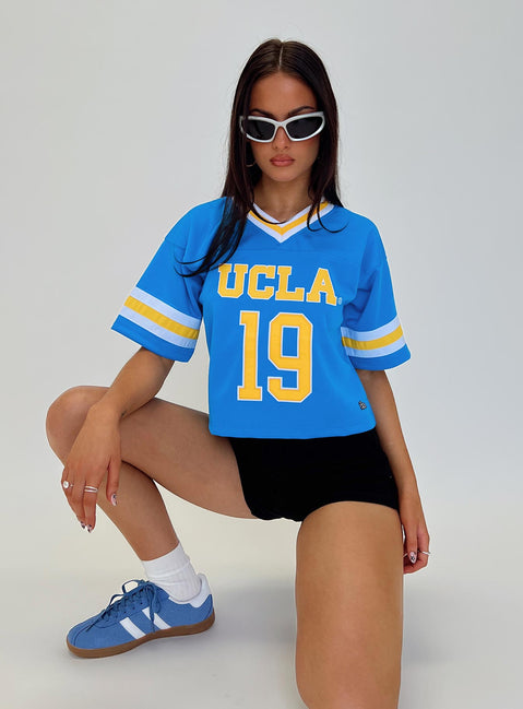 front view of model wearing Princess Polly UCLA Football Jersey Blue Half Sleeves V-Neck 