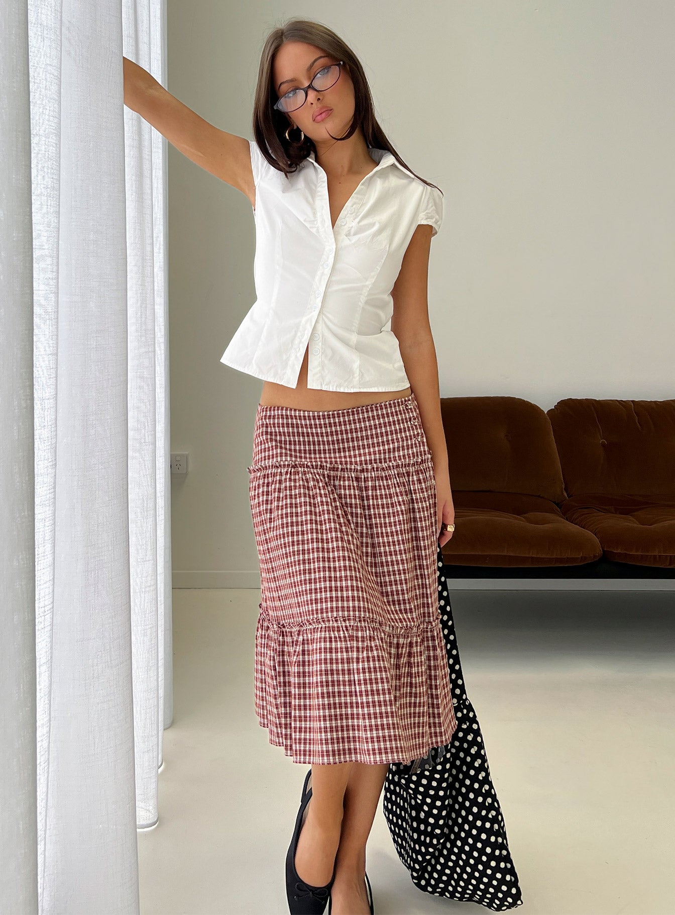   side view of model wearing Princess Polly Cascades Low Rise Midi Skirt Red Check Midi Skirts 