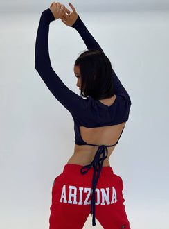 back view of model wearing Princess Polly U of A Bring It Back Long Sleeve Top Navy Full Sleeves Crew Neck 