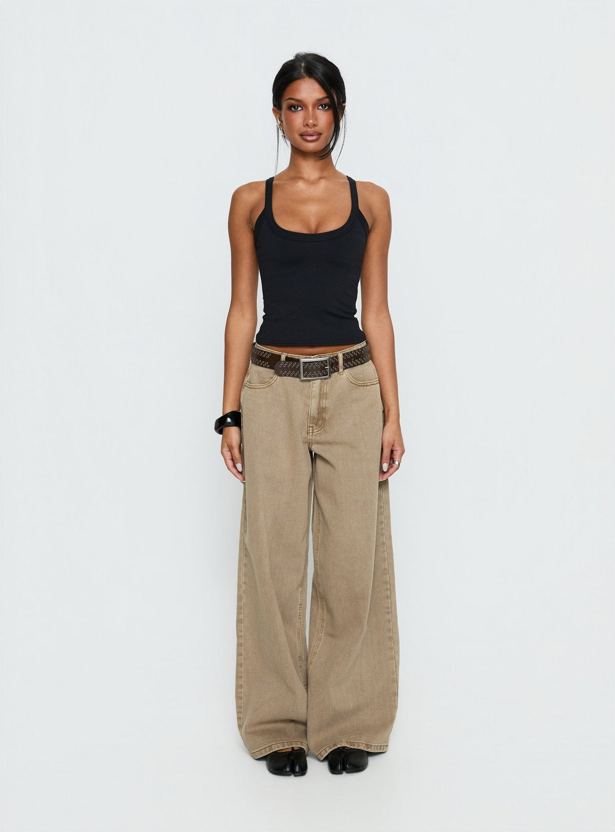 front view of model wearing Princess Polly Naylor Mid Rise Wide Leg Jeans Light Brown Wash Mid Rise Jeans Jeans 