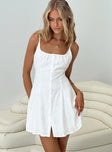 White Linen mini dress Adjustable shoulder straps, scooped neckline, button fastening down front, waist tie fastening at back