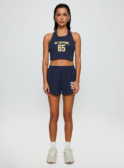 side view of model wearing Princess Polly UC Irvine Soffee Shorts Blue High Waisted Shorts 