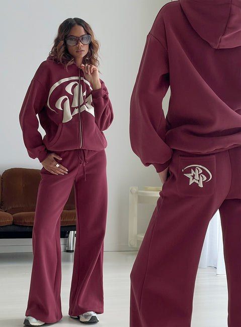 side view of model wearing Princess Polly Princess Polly Stargirl Wide Leg Sweat Pants Burgundy High Rise Pants 