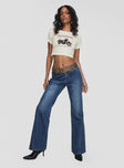 front view of model wearing Princess Polly Leslee Flare Jean Mid Wash Blue Mid Rise 