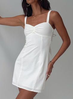 side view of model wearing Princess Polly Summer Isles Mini Dress White Sweetheart Neckline 