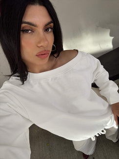 back view of model wearing Princess Polly Wellness Off The Shoulder Jumper Washed White 