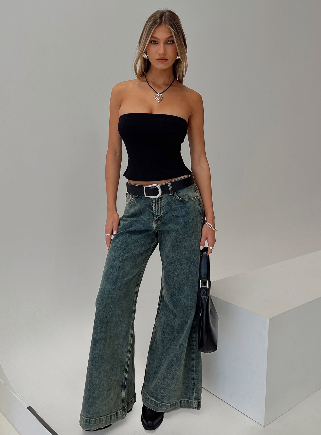 side view of model wearing Princess Polly Aurorah Strapless Top Black Sleeveless straight 