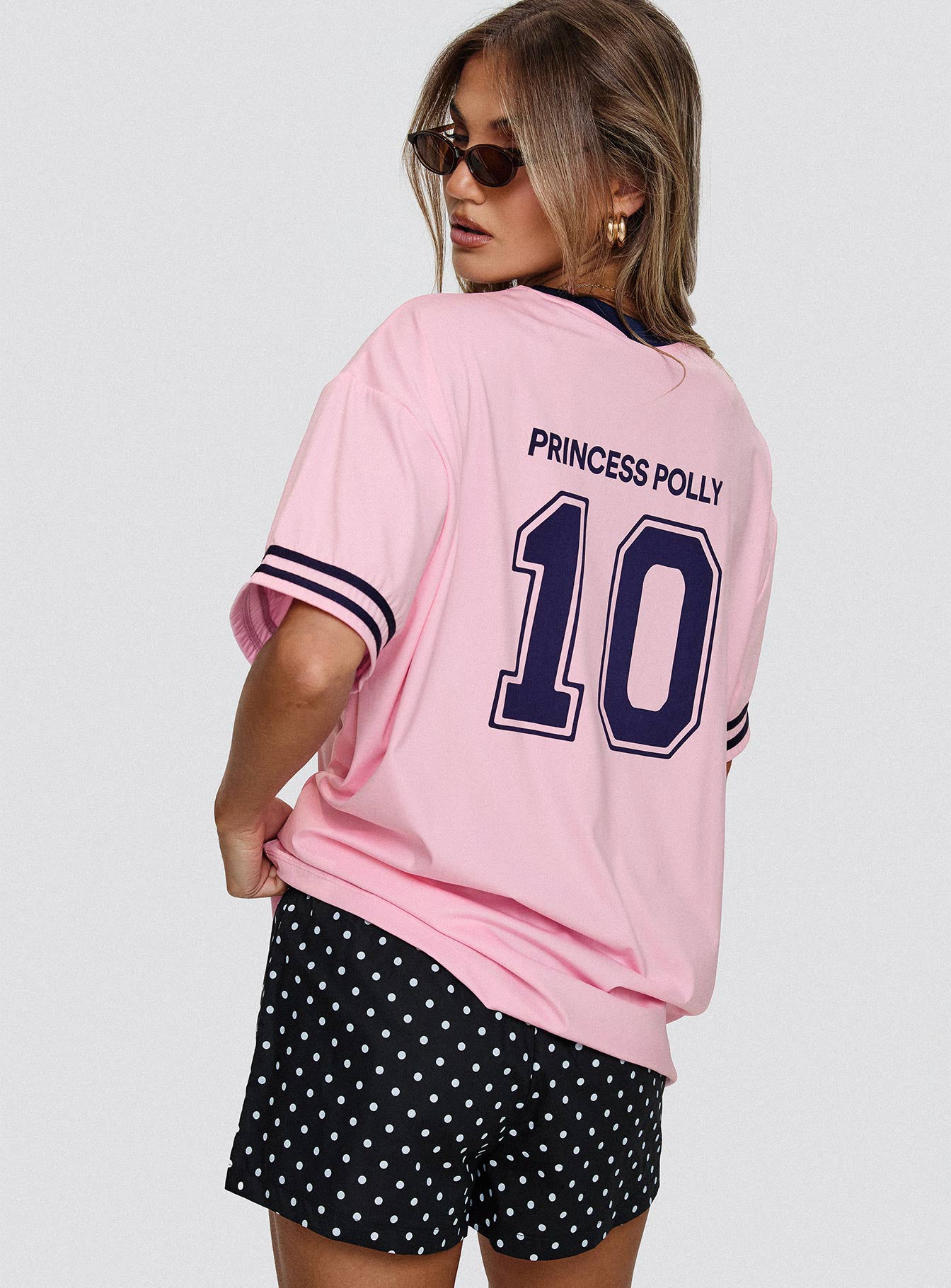 back view of model wearing Princess Polly Cornwall Football Jersey Pink Half Sleeves Crew Neck 
