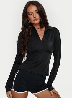 front view of model wearing Princess Polly Celosiah Zip Up Collared Top Black Full Sleeves V-Neck 