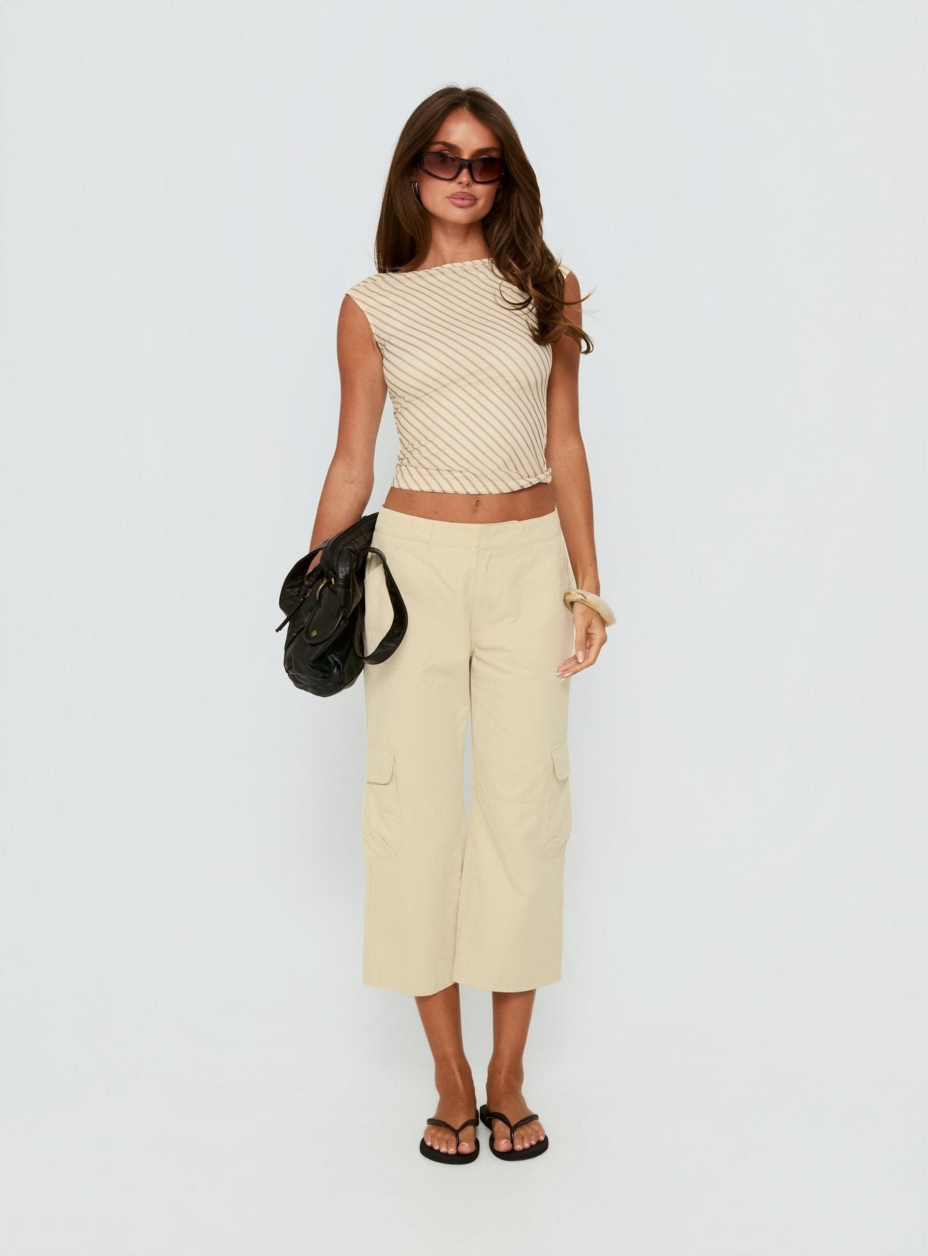 front view of model wearing Princess Polly Indee Cropped Cargo Pants Beige Mid Rise Pants Pants 