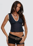 front view of model wearing Princess Polly Hagea Top Navy Sleeveless Plunger 