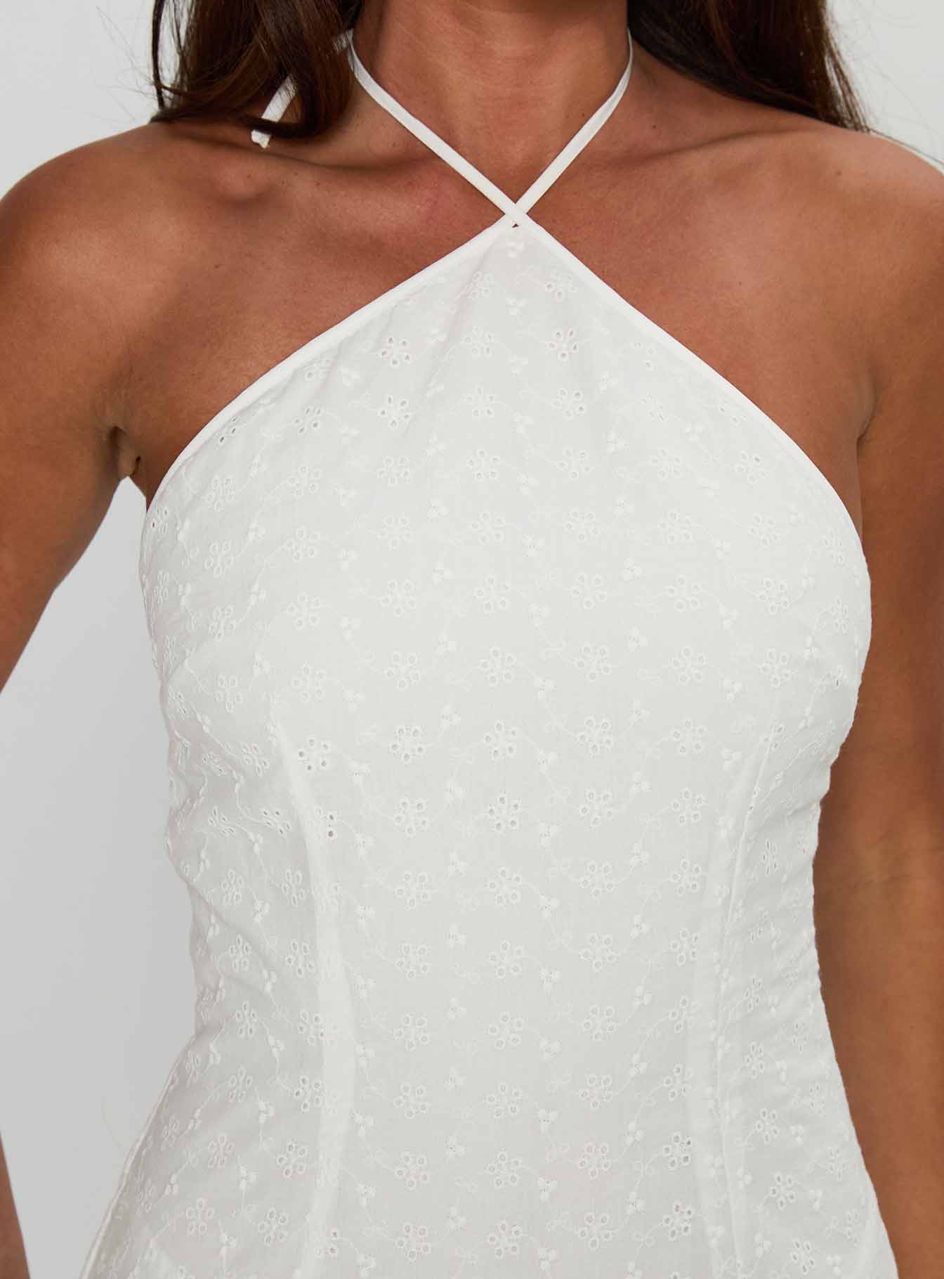 back view of model wearing Princess Polly Flowerchild Halter Mini Dress White Asymmetric Neckline 