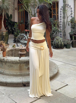 back view of model wearing Princess Polly Full Orbit Shirred Maxi Skirt Cream Maxi 