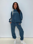 front view of model wearing Princess Polly Princess Polly Track Pants Block / Cursive Text Slate Mid Rise 