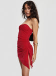 Red Strapless mini dress inner silicone strap at bust, tie fastening detail, ruching at side, asymmetric hem