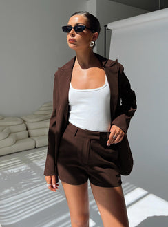 front view of model wearing Princess Polly Ellerie Tailored Shorts Chocolate High Waisted Shorts 