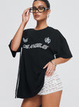 front view of model wearing Princess Polly Goal La Oversized Tee Black Half Sleeves Crew Neck 