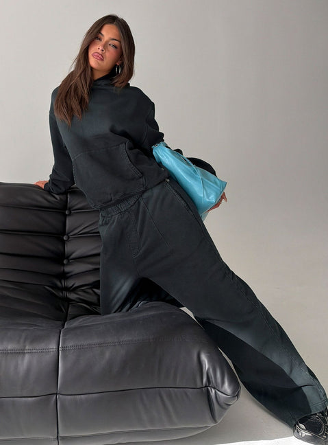 Showcasing black Baggy Sweatpant in womens regular pants with wide-leg mid-rise silhouette side view of model wearing Princess Polly
