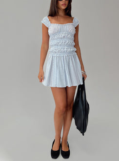 side view of model wearing Princess Polly Wonderlust Shirred Mini Dress Blue Stripe Square Neck 