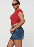   side view of model wearing Princess Polly Faya Low Rise Mini Denim Skirt Vintage Dark Wash Tall Mini Skirts 