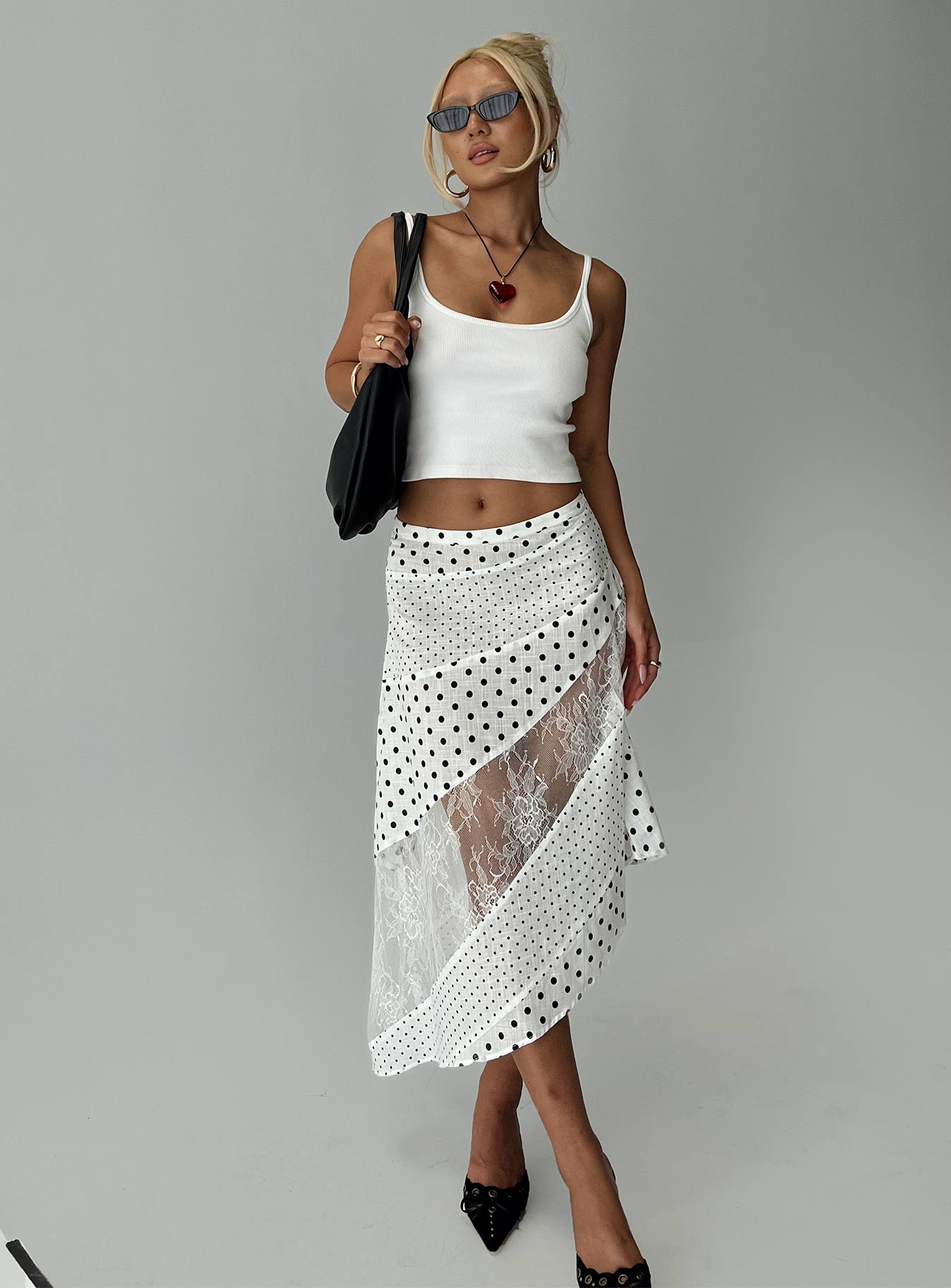   side view of model wearing Princess Polly Rennar Maxi Skirt White / Polka Dot Midi Skirts 