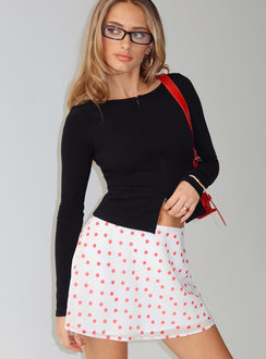   side view of model wearing Princess Polly Dapple Bias Mini Skirt White / Red Polka Mini Skirts 