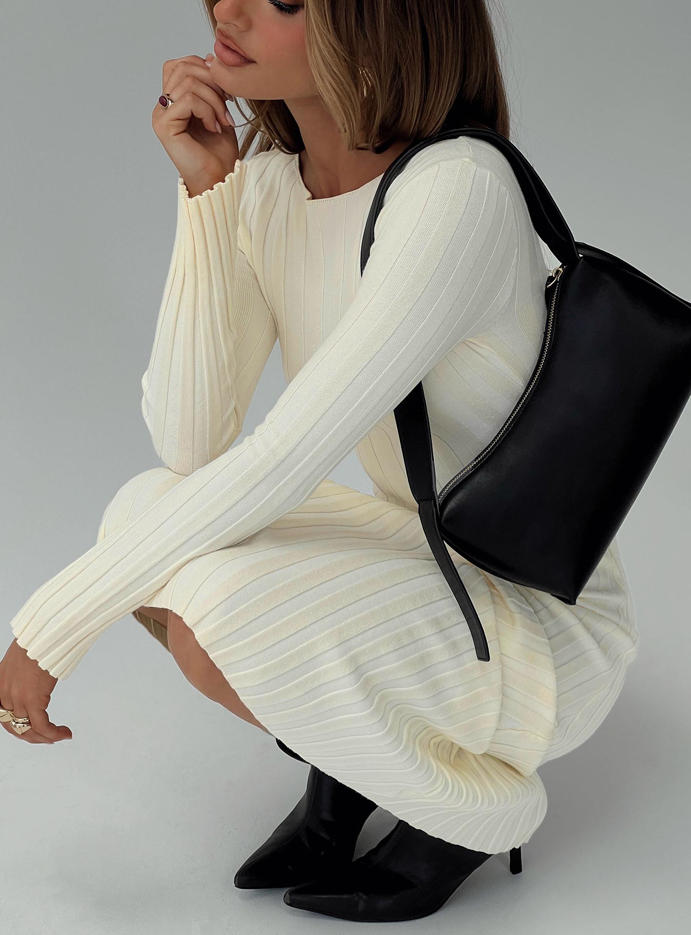 side view of model wearing Princess Polly Ryo Long Sleeve Rib Maxi Dress Cream Boat Neck 