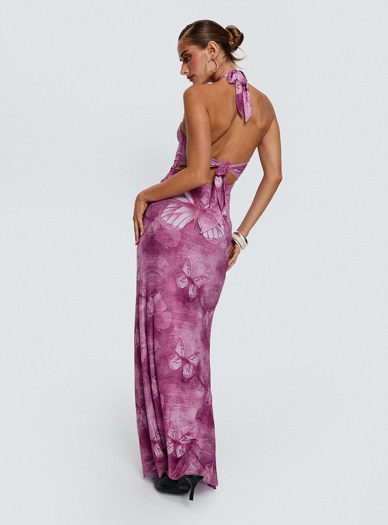 back view of model wearing Princess Polly Nathaleia Halter Maxi Dress Purple Asymmetric Neckline 