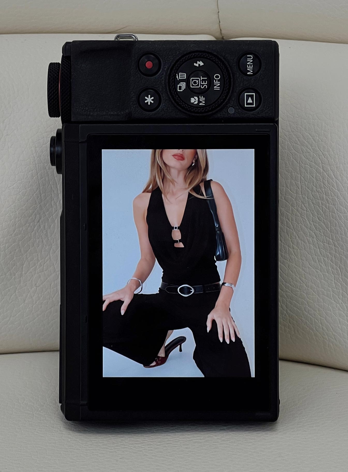 front view of model wearing Princess Polly Camera Flash Halter Top Black Glitter Sleeveless Cowl 