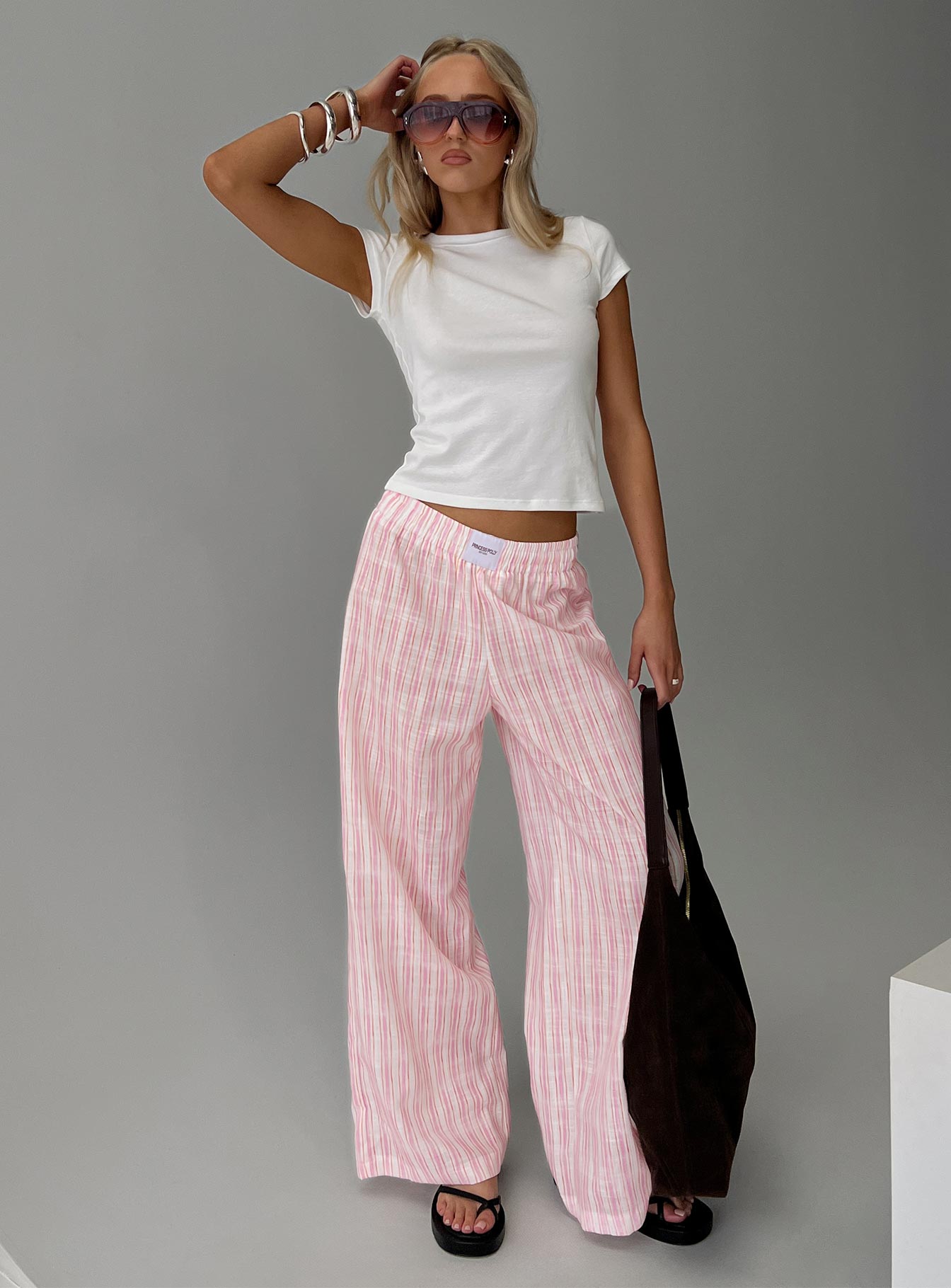 front view of model wearing Princess Polly Beach House Pants Pink Stripe High Waisted Pants 