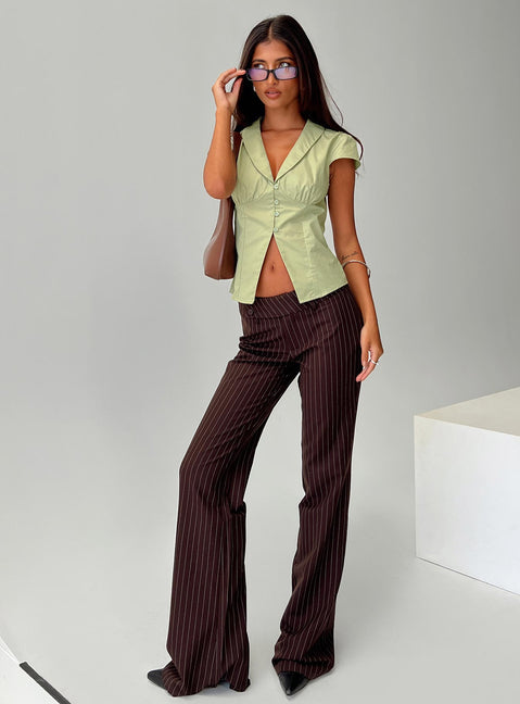 side view of model wearing Princess Polly Kinkirk Flared Pants Brown Pinstripe Low Rise Pants 