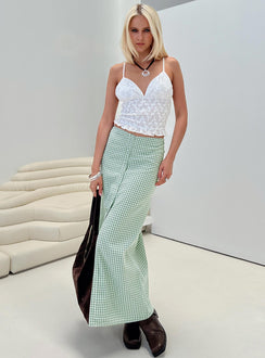   side view of model wearing Princess Polly Macadamia Maxi Skirt Green / White Maxi 