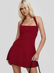 side view of model wearing Princess Polly Alyn Halter Mini Dress Wine Red Petite Square Neck 