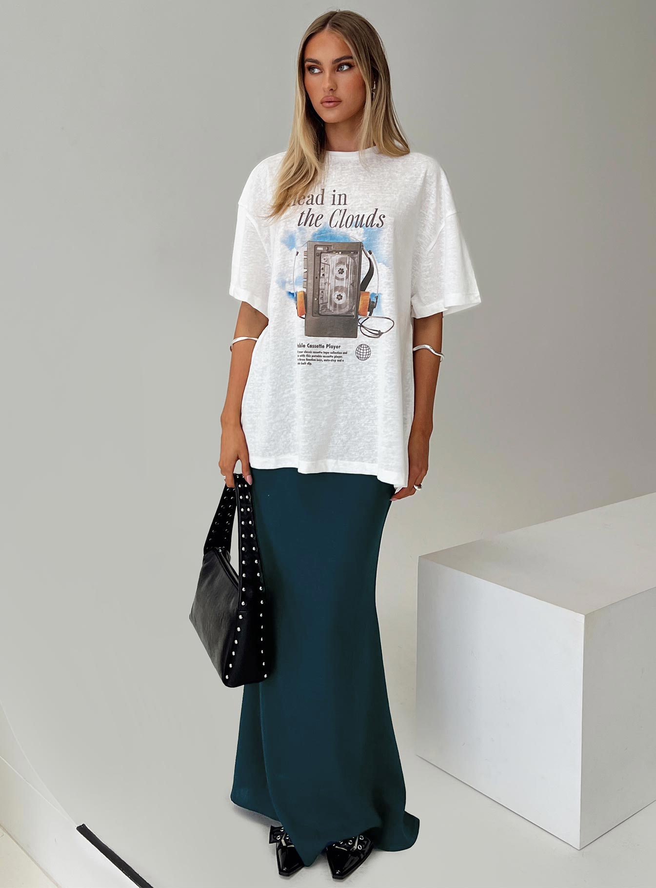 side view of model wearing Princess Polly Cloud Cassette Oversized Tee White Full Sleeves High Neck 
