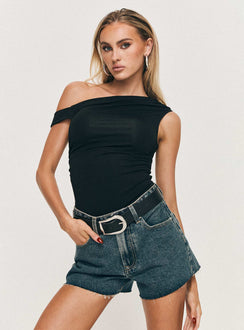 front view of model wearing Princess Polly Get It Right Mid Rise Denim Shorts Dark Denim Wash High Waisted Shorts 