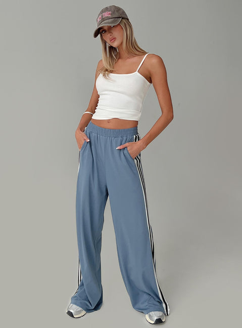 side view of model wearing Princess Polly Dime Track Pants Blue High Waisted Pants 