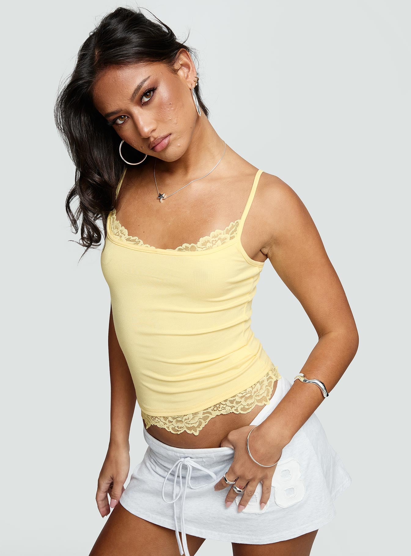 side view of model wearing Princess Polly Falling Through Lace Detail Top Lemon Sleeveless Scoop Neck 