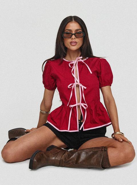 front view of model wearing Princess Polly Ryota Blouse Red/pink Short Sleeves Crew Neck 