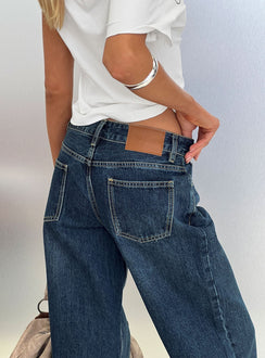 back view of model wearing Princess Polly Serenitia Mid Rise Straight Leg Relaxed Jeans Dark Blue Wash Mid Rise Jeans 