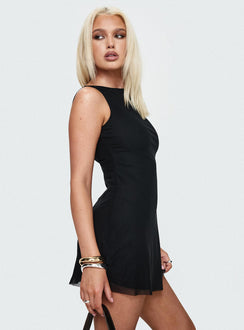 side view of model wearing Princess Polly Lukea Sleeveless Mini Dress Black Boat Neck 