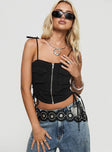 Denim cargo top Straight neckline, adjustable tie straps, twin breast pockets, exposed zip fastening, tie details at side Non-stretch material, unlined 